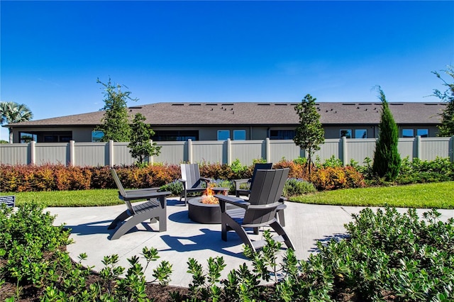 view of patio with a fire pit