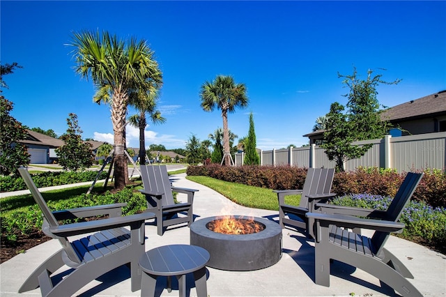 view of patio / terrace featuring an outdoor fire pit