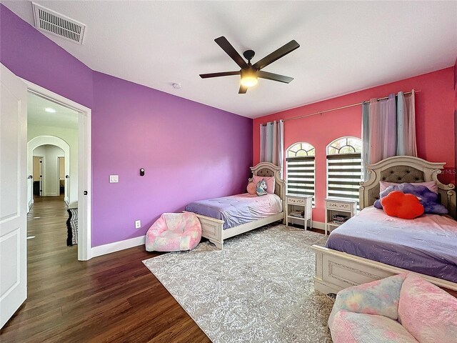 bedroom featuring hardwood / wood-style floors and ceiling fan