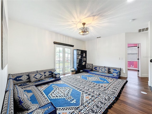 living room with french doors and hardwood / wood-style floors