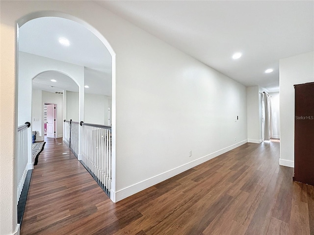 corridor featuring dark wood-type flooring