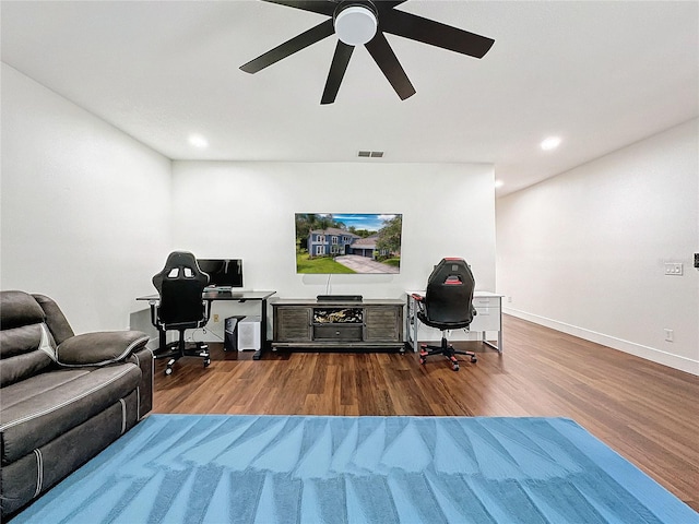 office with ceiling fan and hardwood / wood-style flooring