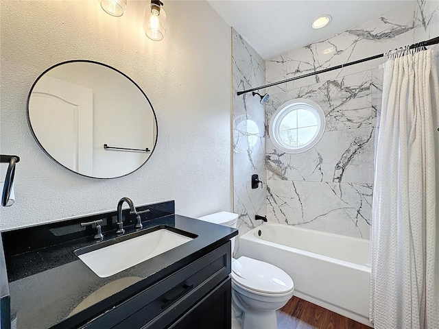 full bathroom with vanity, toilet, shower / bathtub combination with curtain, and hardwood / wood-style flooring