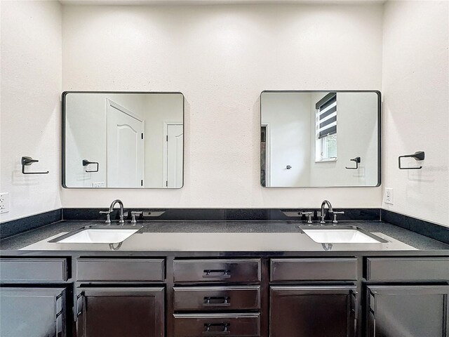 bathroom featuring double vanity