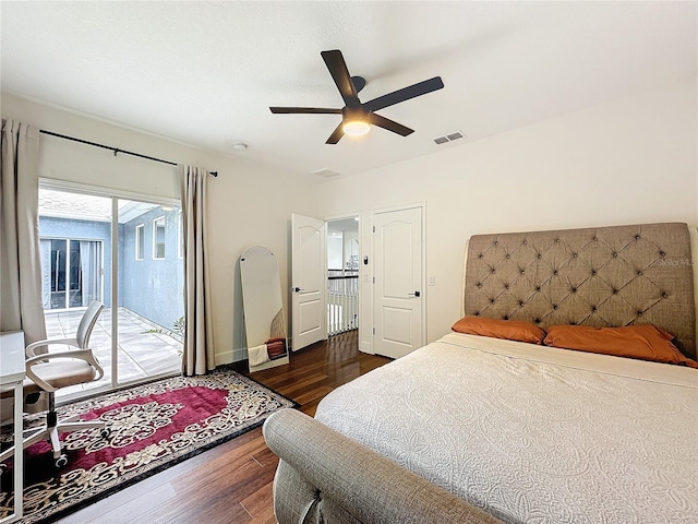 bedroom featuring ceiling fan, access to exterior, and dark wood-type flooring