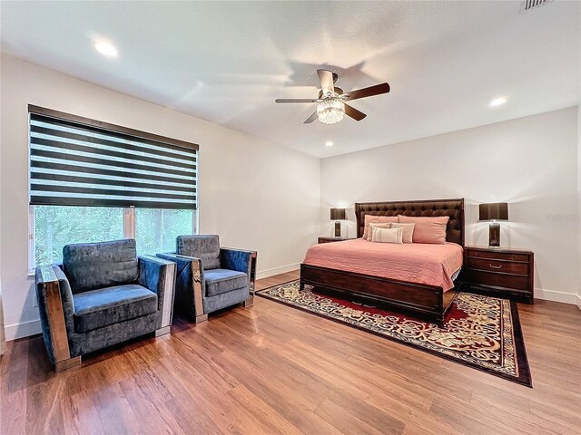 bedroom featuring ceiling fan and hardwood / wood-style floors