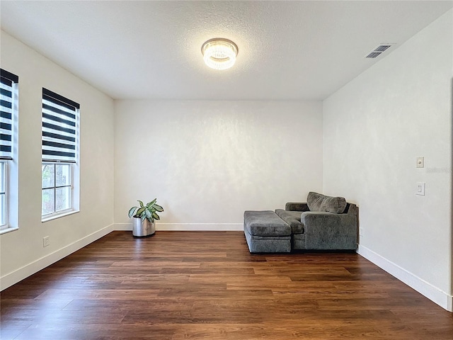 living area with dark hardwood / wood-style flooring