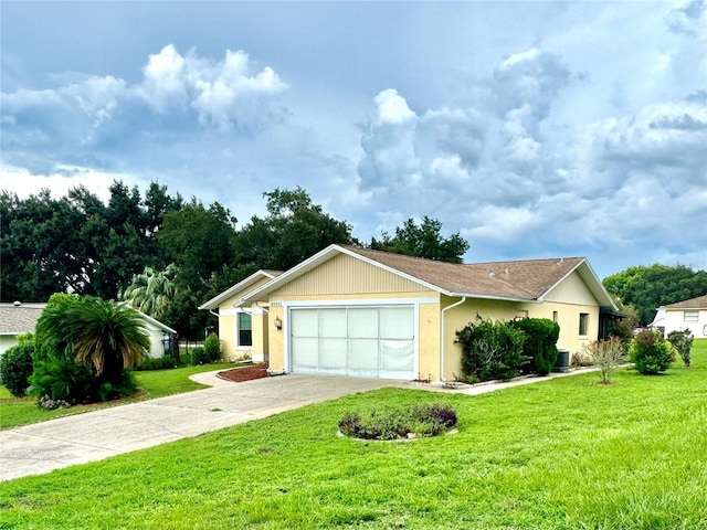 ranch-style house with a garage and a front lawn