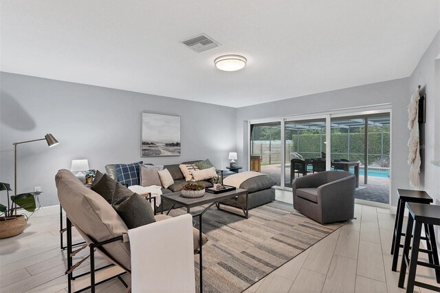 living room with light hardwood / wood-style flooring