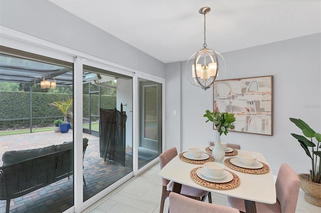 dining room with light tile patterned flooring and an inviting chandelier