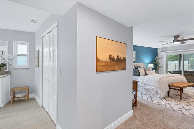 carpeted bedroom with ceiling fan