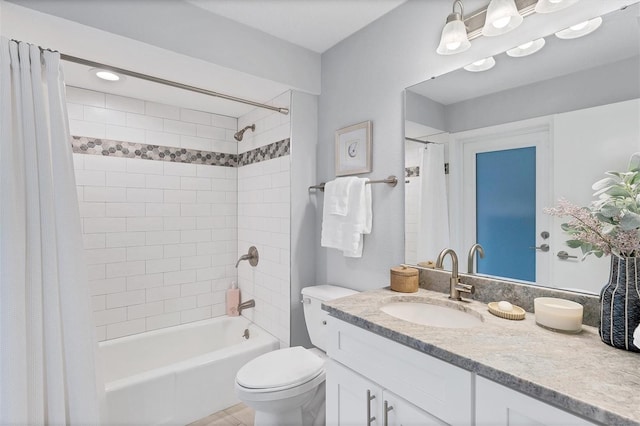 full bathroom featuring vanity, tile patterned floors, shower / bath combo, and toilet