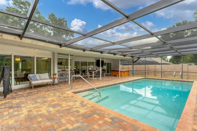 view of pool featuring a lanai and a patio