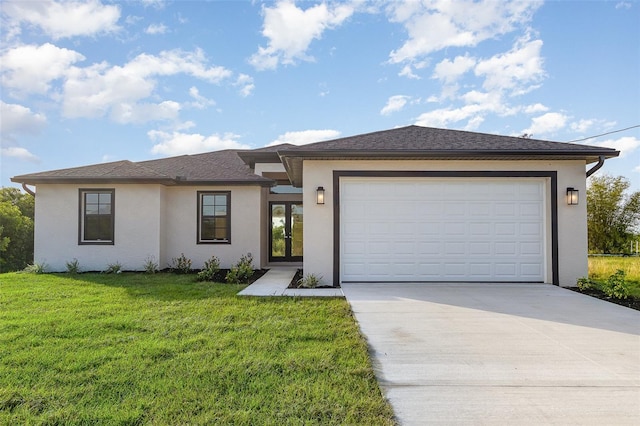 prairie-style house featuring a garage, stucco siding, concrete driveway, and a front yard