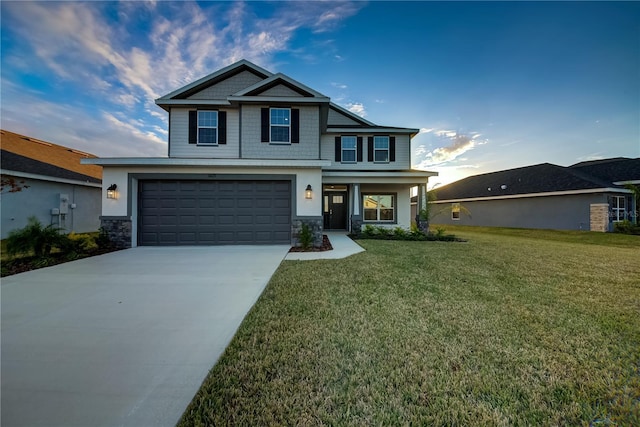 craftsman house with a garage and a front yard