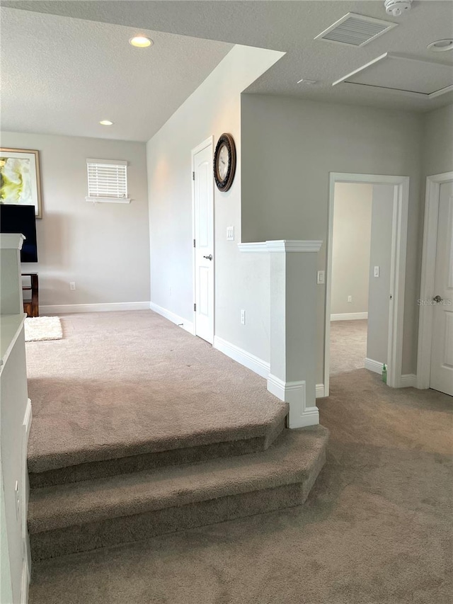 interior space featuring a textured ceiling