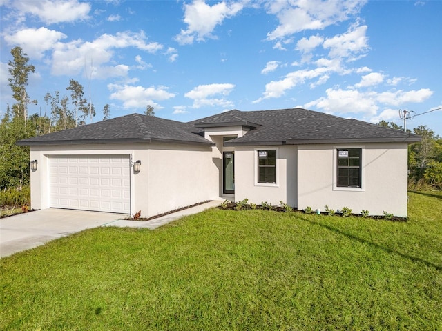 view of front of home featuring a garage and a front lawn