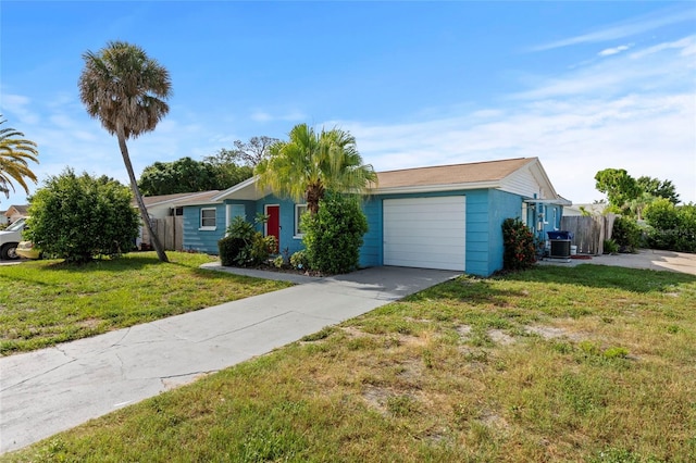 ranch-style home with a front yard, a garage, and cooling unit