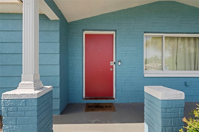 view of exterior entry featuring a porch