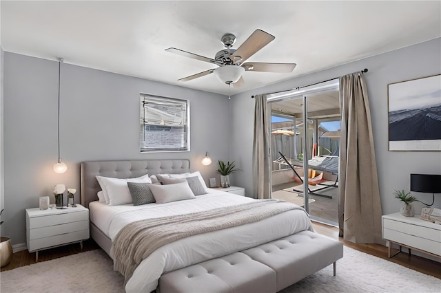 bedroom featuring ceiling fan, access to exterior, and dark hardwood / wood-style flooring