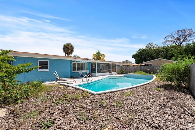 view of pool with a patio area and a sunroom