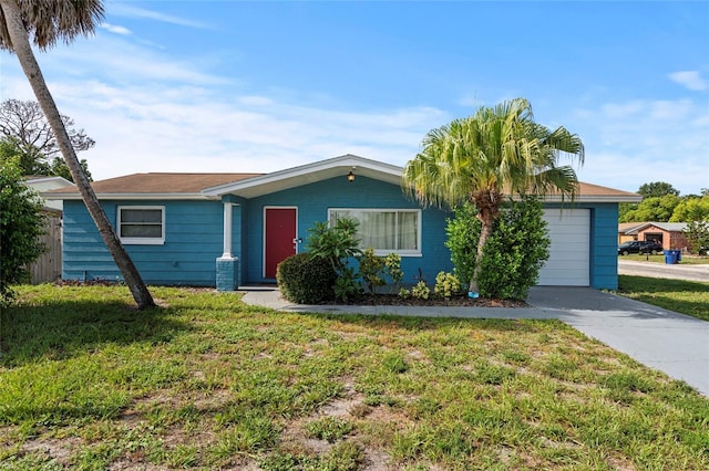 single story home featuring a front lawn and a garage