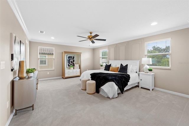 bedroom featuring ceiling fan, light carpet, and crown molding