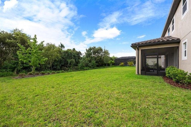 view of yard featuring a sunroom