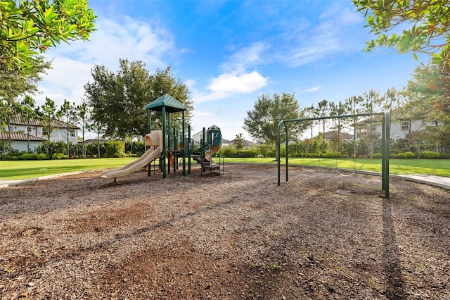 view of jungle gym featuring a lawn