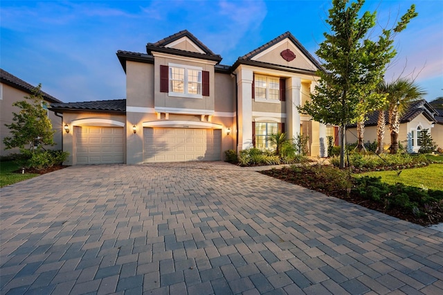 view of front of property with a garage