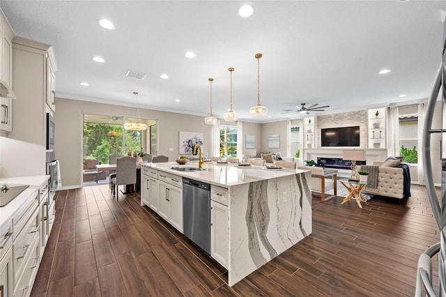 kitchen featuring ceiling fan, visible vents, a healthy amount of sunlight, and appliances with stainless steel finishes