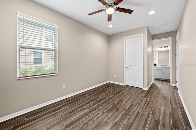 unfurnished bedroom featuring recessed lighting, dark wood-type flooring, baseboards, visible vents, and a ceiling fan