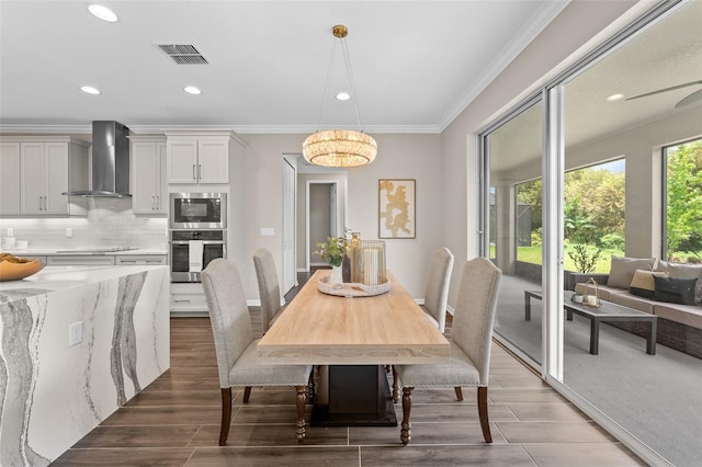 dining space with ornamental molding, visible vents, wood finish floors, and recessed lighting