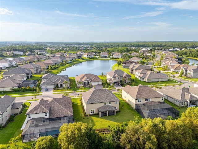 bird's eye view featuring a residential view and a water view