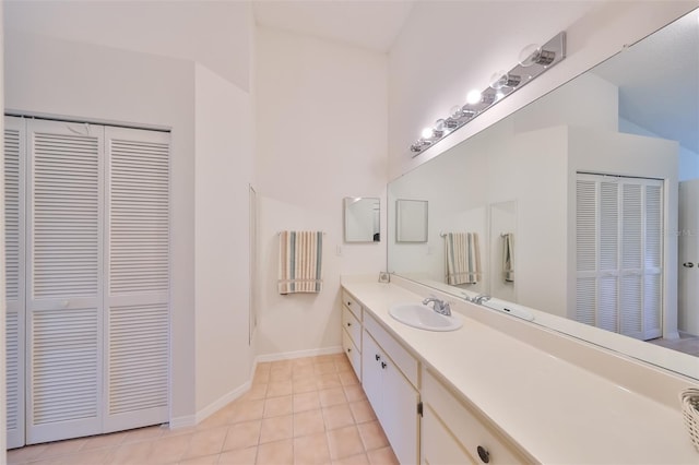 bathroom featuring tile patterned flooring and vanity