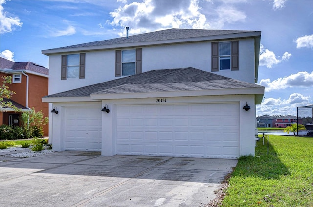 20131 Nob Oak Ave, Tampa, FL 33647 - view of front of property with driveway, stucco siding, a shingled roof, and a garage