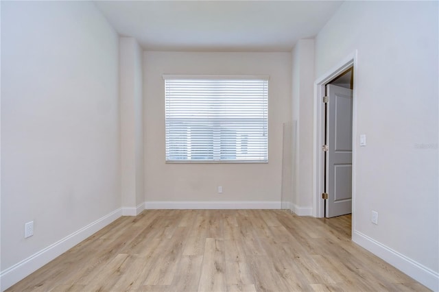 spare room featuring light hardwood / wood-style floors