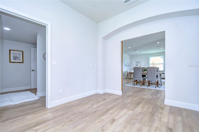 spare room featuring light hardwood / wood-style flooring