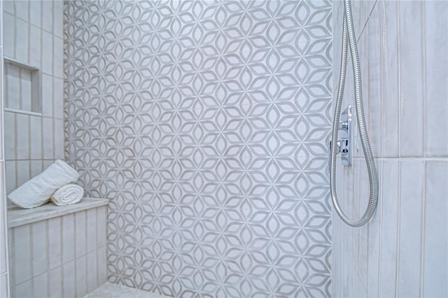 bathroom with tiled shower