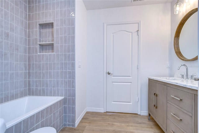 bathroom featuring vanity and hardwood / wood-style flooring