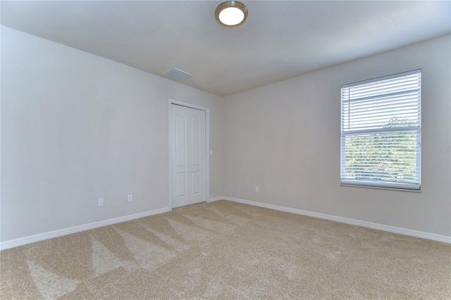 spare room featuring carpet floors