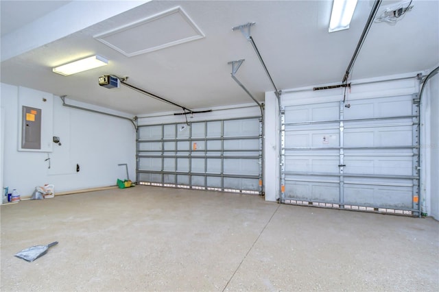 garage with a garage door opener and electric panel