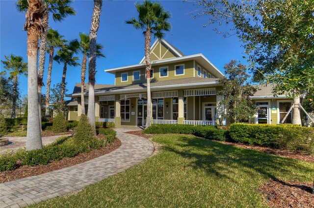 view of front of home featuring a porch and a front lawn