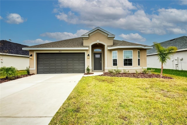 view of front facade featuring a garage and a front lawn