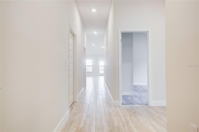 hall with light wood-type flooring