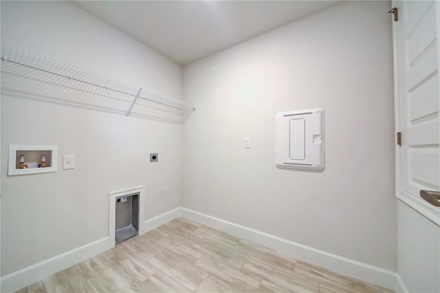 laundry area with washer hookup, light wood-type flooring, and electric dryer hookup