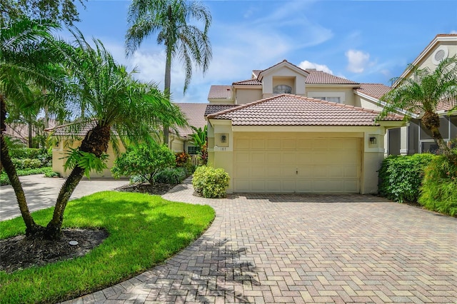 mediterranean / spanish-style home featuring a garage