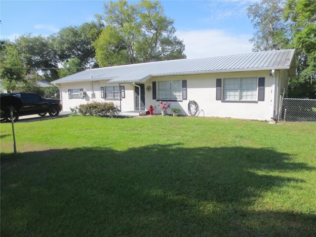 ranch-style home with a front yard