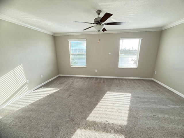 empty room with ceiling fan, carpet flooring, and a wealth of natural light