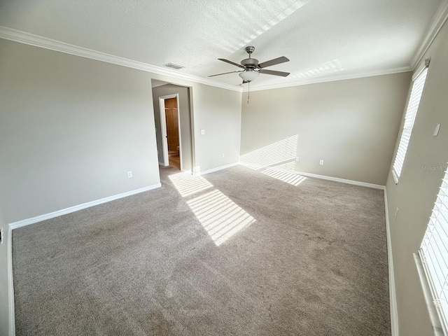 empty room with crown molding, a textured ceiling, carpet, and ceiling fan